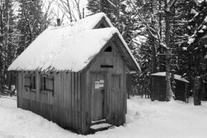 An image of the Bryant Cabin in mid-December during a ski tour out on the Nordic & Backcountry Network at Bolton Valley Ski Resort in Vermont