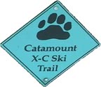 An image of a trail sign for the Catamount Trail showing the Catamount Trail logo