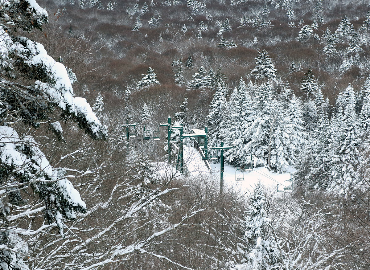 An image of the mid station terminal of the Wilderness Double Chairlift from above at Bolton Valley Ski Resort in Vermont