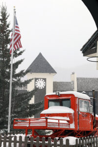 An image of a snowcat with fresh snow falling during Winter Storm Ember in the Village are of Bolton Valley Ski Resort in Vermont