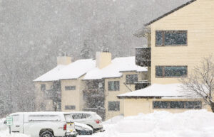 An image of heavy snowfall from Winter Storm Gerri with condominiums in the background in the Village area at Bolton Valley Ski Resort in Vermont