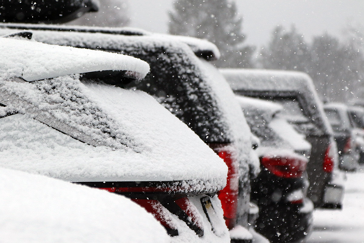 An image of snow falling during Winter Storm Gerri on cars in a parking lot in the Village area at Bolton Valley Ski Resort in Vermont