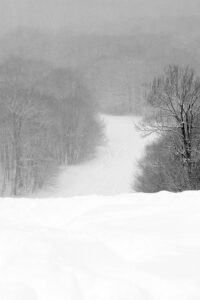 An image of the steep headwall area of the Spell Binder trail in the Timberline area during Winter Storm Tormund in April 2024 at Bolton Valley Ski Resort in Vermont