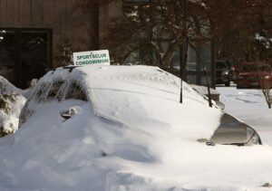 An image of a car covered with wind-driven drifted snow after a March storm cycle at Bolton Valley Ski Resort in Vermont