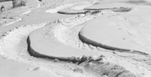 Ski tracks in powder snow on the Perry Merrill trail at Stowe Mountain Resort in Vermont after a mid-October snowstorm brought more than a foot of snow to the higher elevations