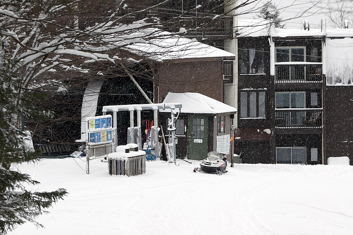 An image of snow falling at the base of the Wilderness Double Chairlift during the Thanksgiving 2024 snowstorm at Bolton Valley Ski Resort in Vermont