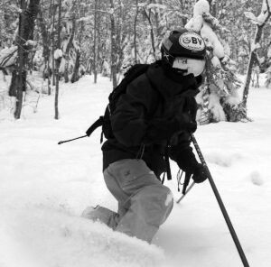 An image of Ty getting some early season Telemark ski turns in the backcountry after a series of small storms begins to set up the snowpack at Bolton Valley Ski Resort in Vermont