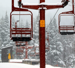 An image near the top of the Snowflake Double Chairlift with December snowfall at Bolton Valley Ski Resort in Vermont