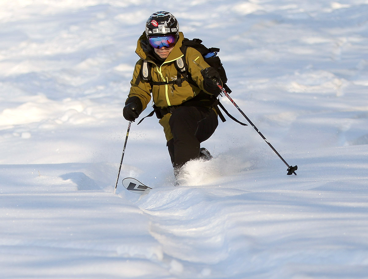 An image of Jay Telemark skiing in excellent powder snow in December while ski touring in the Timberline area at Bolton Valley Ski Resort in Vermont