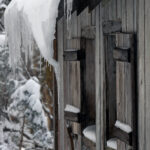 An image of icicles and snow hanging off the roof of the Bryant Cabin on the Nordic and Backcountry Network of trails at Bolton Valley Ski Resort in Vermont