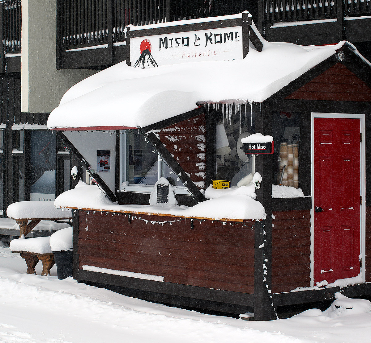 An image of snow accumulations at the sheltered location of the Miso Toh Kome Hut near the base lodge during a long duration, windy winter storm in January at Bolton Valley Ski Resort in Vermont