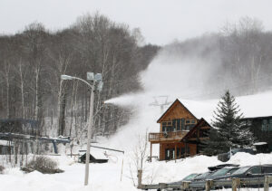 An image of snowmaking taking place at the base are of Timberline at Bolton Valley Ski Resort in Vermont